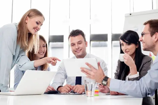 Group of business people working with digital tablet in office