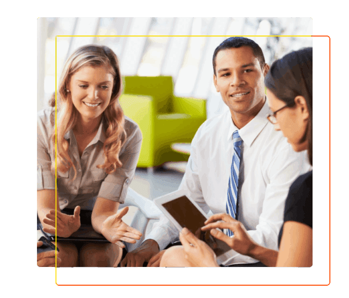 Businesspeople With Digital Tablet Having Meeting In Office Smiling